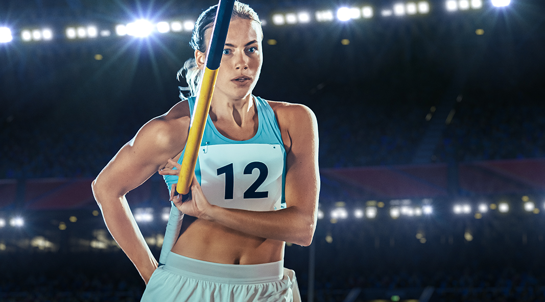 Pole Vaulter sets her mark before beginning her vault.