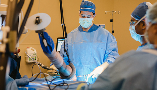 Dr. Adam Anz performs surgery at the Andrew's Institute.